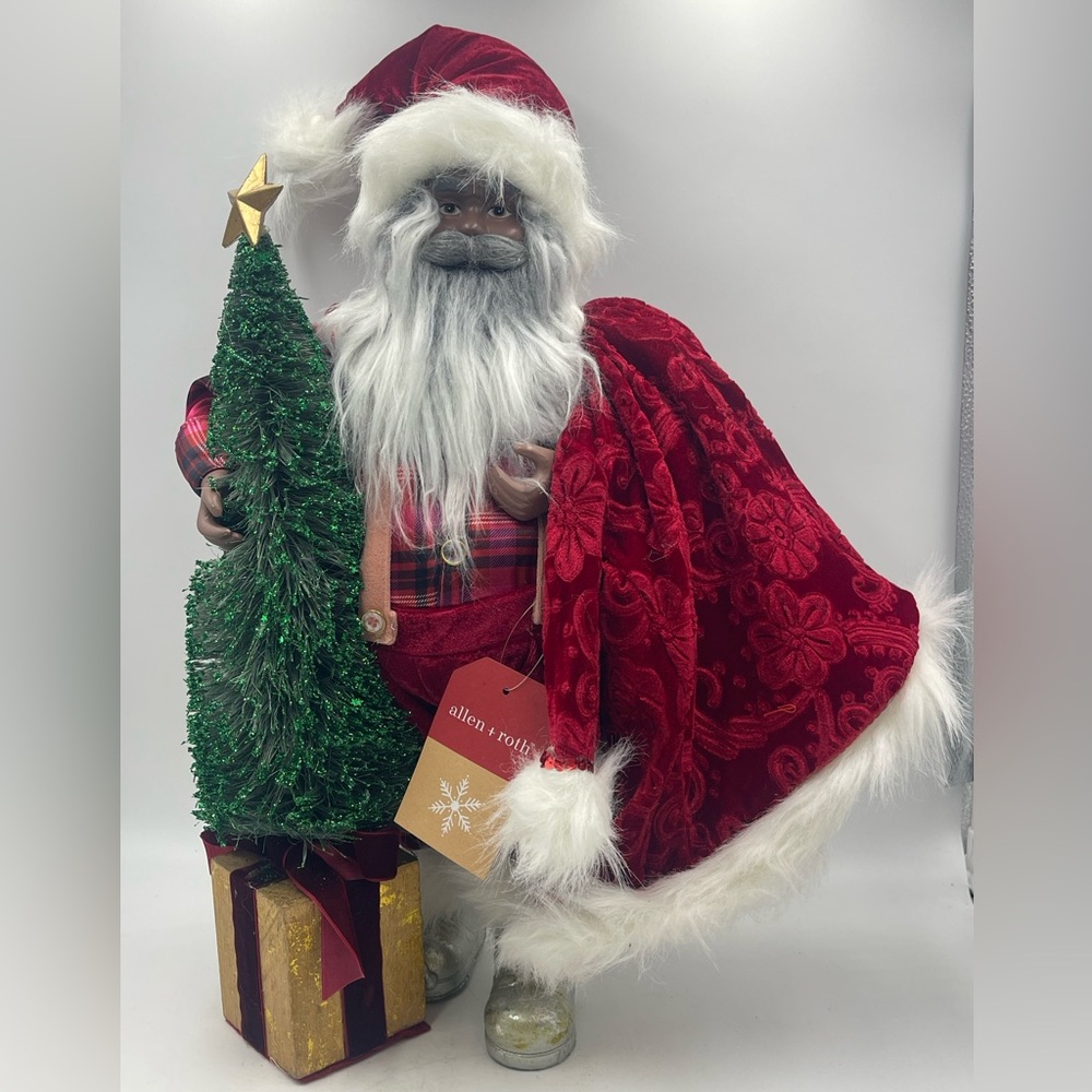 Allen & Roth: African American Santa Clause Holds His Red Coat & Christmas Tree